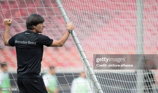 Germany's coach Joachim Loew is standing at the goal during a training session in the Mercedes-Benz Arena in Stuttgart, Germany, 03 September 2017....