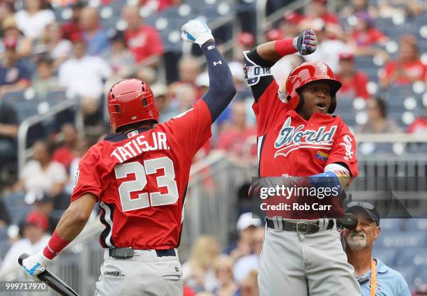 Luis Basabe of the Chicago White Sox and the World Team celebrates his two-run home run in the third inning with teammate Fernando Tatis of the San...