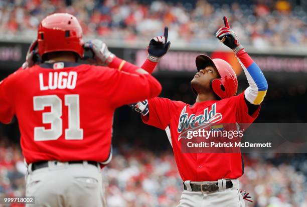 Luis Basabe of the Chicago White Sox and the World Team celebrates his two-run home run in the third inning against the U.S. Team during the SiriusXM...