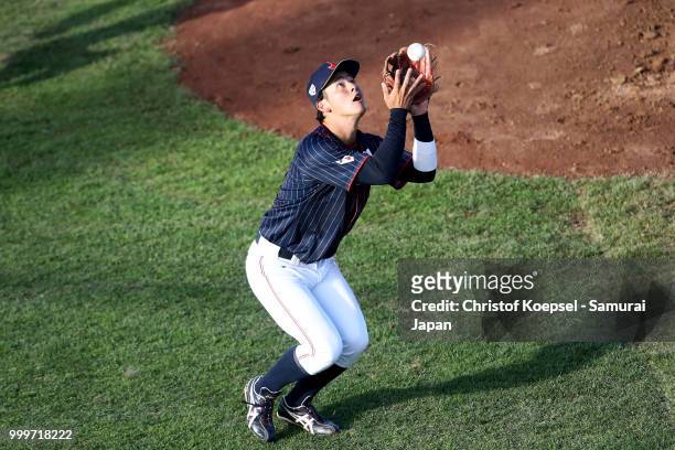 Yukiya Ito of Japan catches the ball in the first inning during the Haarlem Baseball Week game between Cuba and Japan at Pim Mulier Stadion on July...