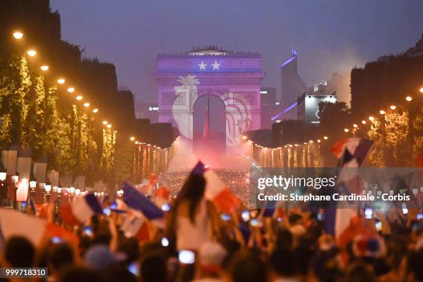 General view of the Champs Elysees with the Arc de Triomphe as the fans celebrate the Victory of France in the World Cup 2018, on July 15, 2018 in...