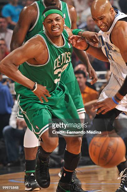 Paul Pierce of the Boston Celtics chases the loose ball against Vince Carter of the Orlando Magic in Game Two of the Eastern Conference Finals during...