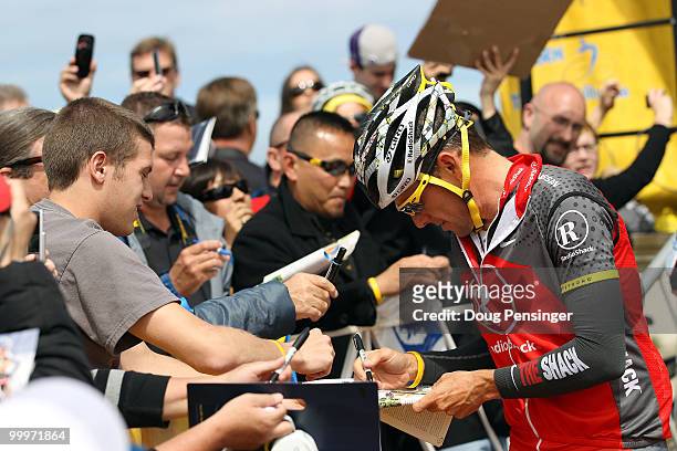 Lance Armstrong of the USA and riding for Radio Shack signs autographs for fans at the start of Stage Three of the 2010 Tour of California from San...