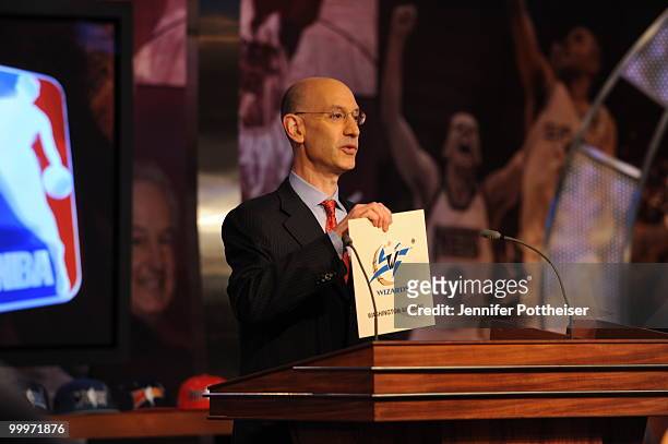 Deputy Commissioner Adam Silver holds up the winning team, the Washington Wizards during the 2010 NBA Draft Lottery at the Studios at NBA...