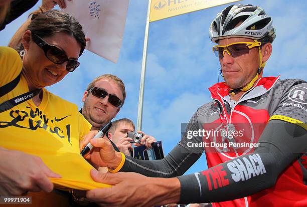 Lance Armstrong of the USA and riding for Radio Shack signs autographs for fans at the start of Stage Three of the 2010 Tour of California from San...