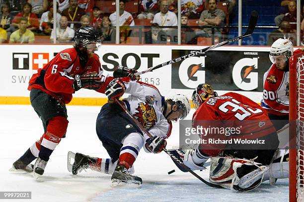 Philip Grubauer of the Windsor Spitfires stops the puck on a shot by Gabriel Bourque of the Moncton Wildcats during the 2010 Mastercard Memorial Cup...