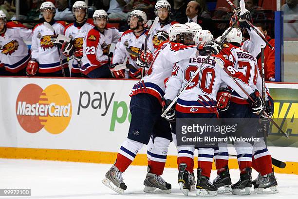 Members of the Moncton Wildcats celebrate the first period goal by Gabriel Bourque during the 2010 Mastercard Memorial Cup Tournament against the...