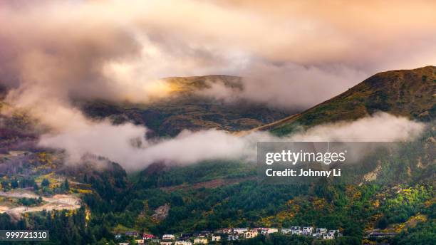 thick fog over mountain during sunrise - li stock pictures, royalty-free photos & images