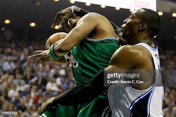 Paul Pierce of the Boston Celtics draws contact from Dwight Howard of the Orlando Magic in the second quarter of Game Two of the Eastern Conference...