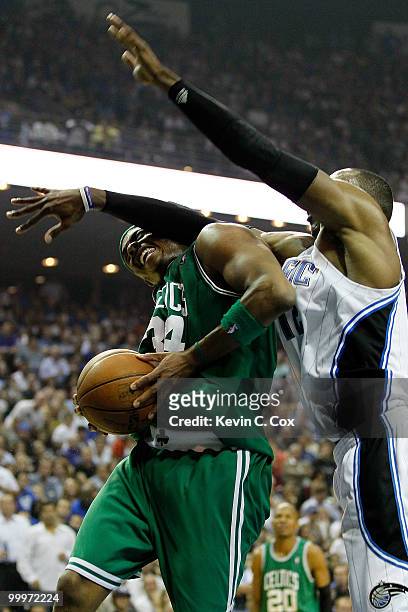 Paul Pierce of the Boston Celtics draws contact from Dwight Howard of the Orlando Magic in the second quarter of Game Two of the Eastern Conference...