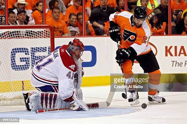 Ville Leino of the Philadelphia Flyers handles the puck in front of Jaroslav Halak of the Montreal Canadiens in Game 2 of the Eastern Conference...