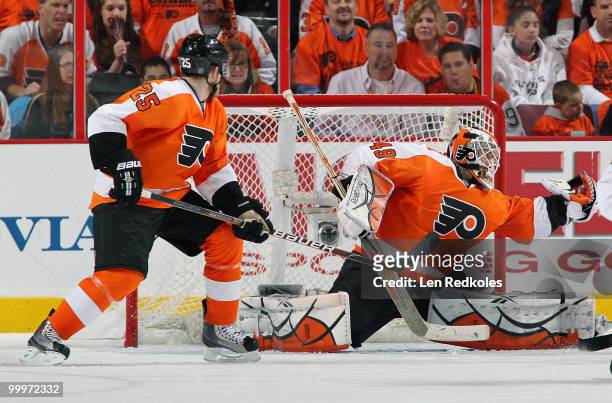 Matt Carle of the Philadelphia Flyers watches as his goaltender, Michael Leighton, makes a glove save against the Montreal Canadiens in Game Two of...
