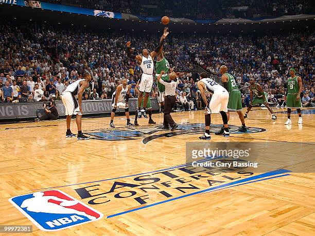 Dwight Howard of the Orlando Magic jumps for the opening tip against Kendrick Perkins of the Boston Celtics in Game Two of the Eastern Conference...