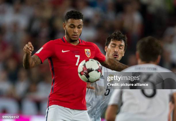 Germany's Mats Hummels and Norway's Joshua King vie for the ball during the soccer World Cup qualification group stage match between Germany and...