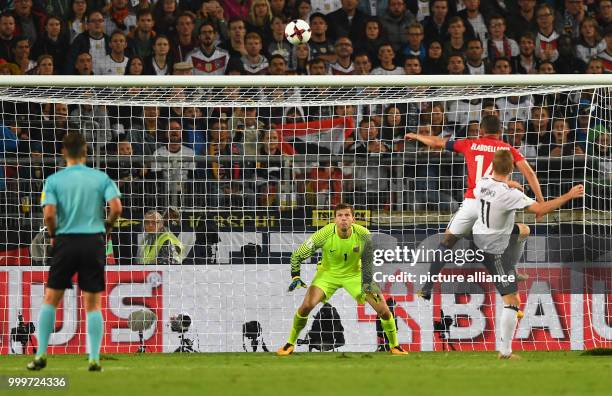 Germany's Timo Werner scores the 4:0 against Norway's Omar Elabdellaoui and goalkeeper Rune Jarstein during the soccer World Cup qualification group...