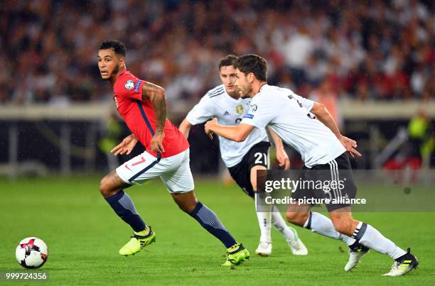 Germany's Sebastian Rudy , Jonas Hector and Norway's Joshua King vie for the ball during the soccer World Cup qualification group stage match between...