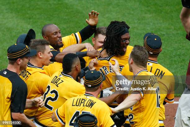 Josh Bell of the Pittsburgh Pirates celebrates after hitting a walk off two RBI double in the tenth inning against the Milwaukee Brewers at PNC Park...