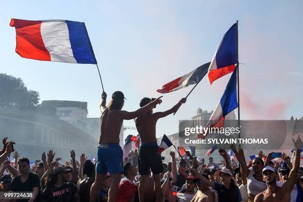 People celebrate after France won the Russia 2018 World Cup final football match between France and Croatia, in Montpellier, southern France, on July...