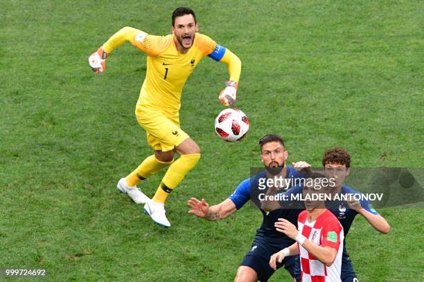 France's goalkeeper Hugo Lloris comes out as France's forward Olivier Giroud France's defender Benjamin Pavard and Croatia's forward Ivan Perisic eye...