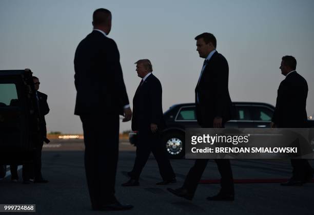 President Donald Trump walks toward the presidential car upon arrival at Helsinki-Vantaa Airport in Helsinki, on July 15, 2018 on the eve of a summit...