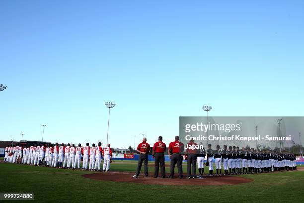 The teams of Cuba and Japan stand for the national anthems prior to the Haarlem Baseball Week game between Cuba and Japan at Pim Mulier Stadion on...