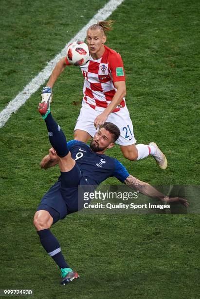 Olivier Giroud of France competes for the ball with Domagoj Vida of Croatia during the 2018 FIFA World Cup Russia Final between France and Croatia at...