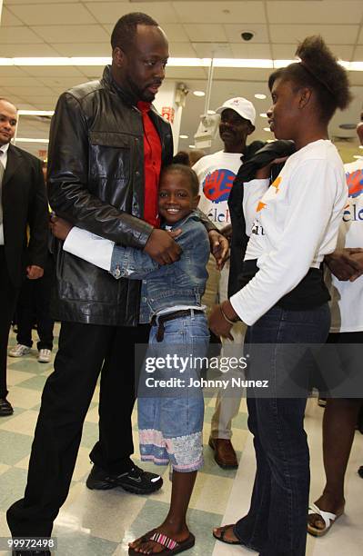 Wyclef Jean and Haiti earthquake victims attend a charity shopping spree at Kmart on May 18, 2010 in New York City.