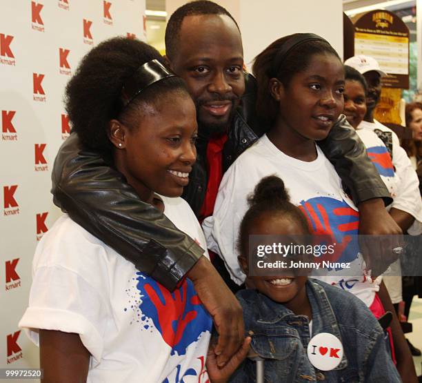 Wyclef Jean and Haiti earthquake victims attend a charity shopping spree at Kmart on May 18, 2010 in New York City.