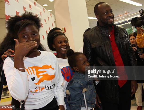 Wyclef Jean and Haiti earthquake victims attends a charity shopping spree at Kmart on May 18, 2010 in New York City.