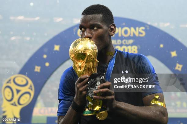 France's midfielder Paul Pogba celebrates with the World Cup trophy after the Russia 2018 World Cup final football match between France and Croatia...