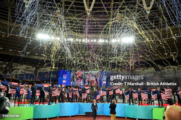 Team USA celebrate as they lift the platinum trophy during day two of the Athletics World Cup London at the London Stadium on July 15, 2018 in...