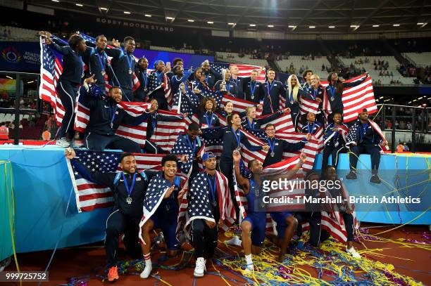 Team USA celebrate as they lift the platinum trophy during day two of the Athletics World Cup London at the London Stadium on July 15, 2018 in...