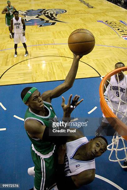 Rajon Rondo of the Boston Celtics attempts a shot against Dwight Howard of the Orlando Magic in Game Two of the Eastern Conference Finals during the...