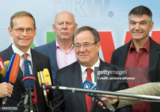 Berlin's Governing Mayor Michael Mueller speaks next to the Prime Minister of North Rhine-Westphalia Armin Laschet in Berlin, Germany, 4 September...