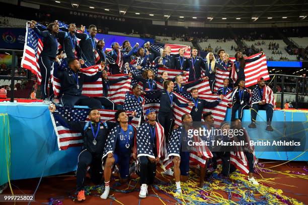 Team USA celebrate as they lift the platinum trophy during day two of the Athletics World Cup London at the London Stadium on July 15, 2018 in...