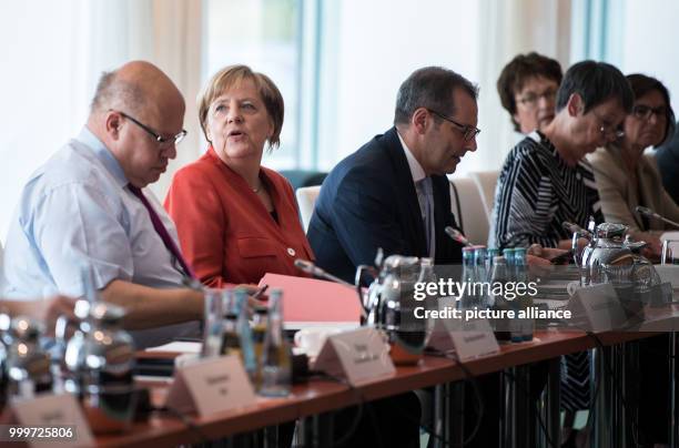 German Chancellor Angela Merkel welcomes the representatives of the federal government, the state governments and the municipalities at a meeting of...