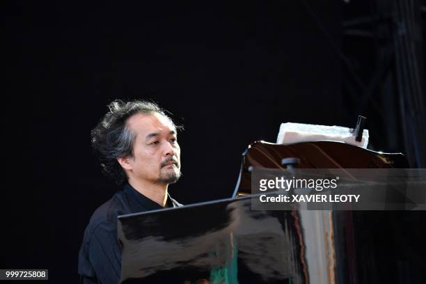 Japanese musician Nobuyuki Nakajima performs with French singer Jane Birkin during the 34th edition of the Francofolies Music Festival in La...