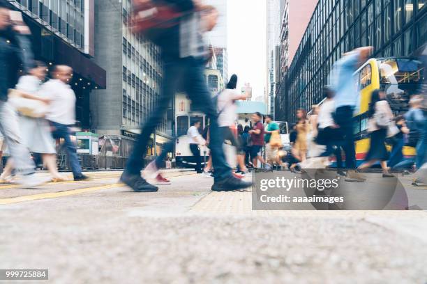 side view of pedestrains rush in hong kong - walking side view stock pictures, royalty-free photos & images