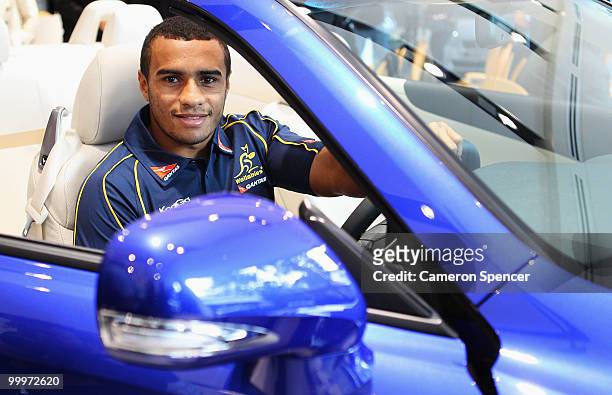 Will Genia of the Wallabies sits in a new Lexus during an Australian Wallabies photocall at Sydney City Lexus on May 19, 2010 in Sydney, Australia.