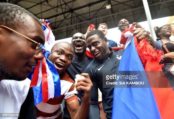 Supporter celebrates France's victory at the end of the Russia 2018 World Cup final football match between France and Croatia, on July 15, 2018 at...
