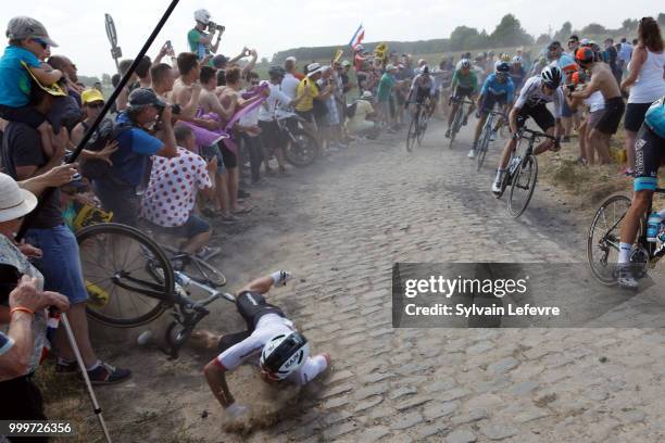Team Sky rider Michal Kwiatkowski of Poland crashes at the 156.5-km of Tour de France 2018 stage 9 from Arras Citadelle to Roubaix on July 15, 2018...