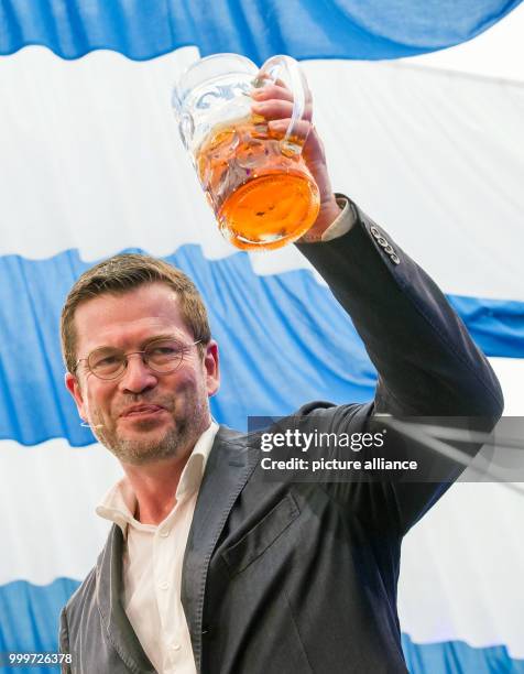 Former Minister of Defence Karl-Theodor zu Guttenberg speaks during the political 'Fruehshoppen' at the Gillamoos folk festival in Abensberg,...