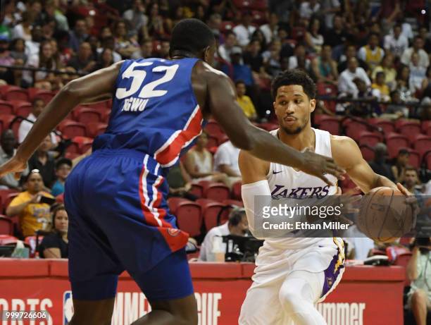 Josh Hart of the Los Angeles Lakers drives against Nnanna Egwu of the Detroit Pistons during a quarterfinal game of the 2018 NBA Summer League at the...