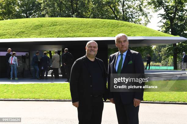 Ludwig Spaenle, Minister of Education in Bavaria , and the architect of the memorial site, Peter Brueckner, stand in front of the memorial site for...