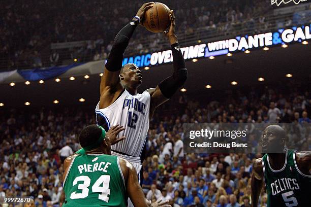 Dwight Howard of the Orlando Magic attempts a shot against Paul Pierce and Kevin Garnett of the Boston Celtics in Game Two of the Eastern Conference...