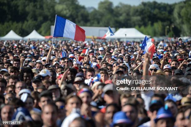 France supporters celebrate in the fan zone in Tours on July 15 after France won the Russia 2018 World Cup final football match between France and...