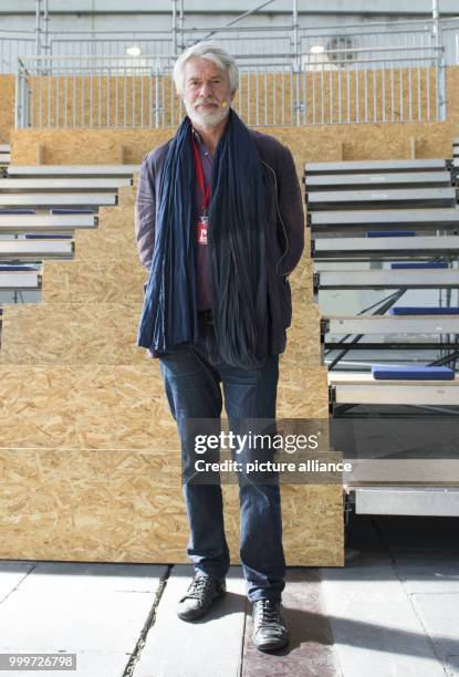 Chris Dercon, artistic director of the Berliner Volksbuehne theatre, explains the plans for a 'Satellitentheater' of the Volksbuehne in a hangar of...