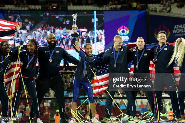 Team USA celebrate as they lift the platinum trophy during day two of the Athletics World Cup London at the London Stadium on July 15, 2018 in...