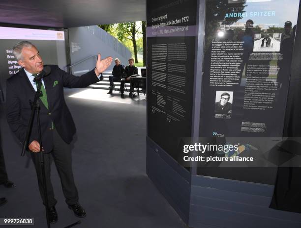 Ludwig Spaenle, Minister of Education in Bavaria , explains an information board at the memorial site for the 1972 Munich massacre of the Israeli...