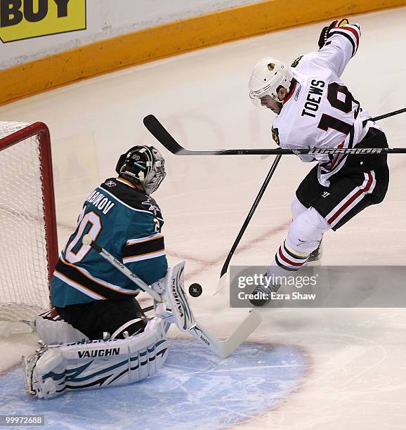 Jonathan Toews of the Chicago Blackhawks shoots the puck on goaltender Evgeni Nabokov of the San Jose Sharks in the first period of Game Two of the...